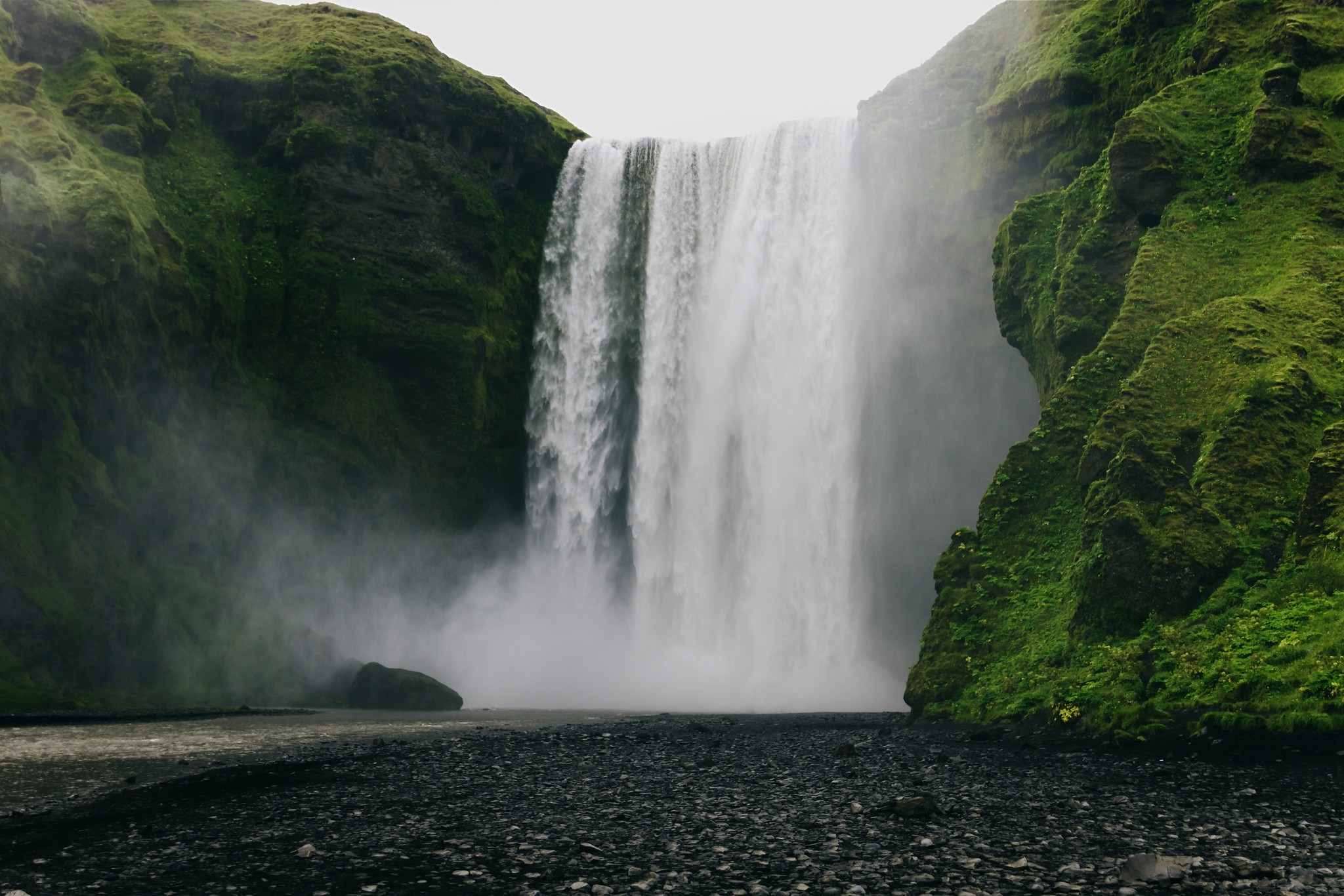Skógafoss Waterfall with heavy mist rising at its base in South Iceland.